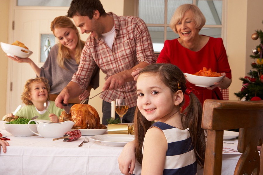 bigstock-family-serving-christmas-dinne-27387584